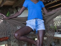 Skinny ebony babe Luz M flaunts her small breasts during a sexy striptease - Photo #2