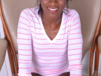 Ebony bombshell Ana Foxxx teasing with her sweet feet & yummy pussy on a chair - Photo #1