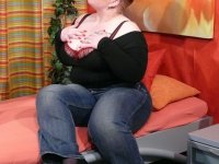 Big fatty Lucie unveils big pierced nipples & tugs cum onto her massive juggs - Photo #1