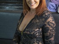 Redheaded female exposes her large breasts and butt in OTK suede boots - Photo #1