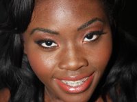 Ebony babe in stockings Osa Lovely having a gangbang with a group of locals - Photo #1