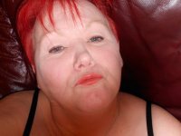 Mature redhead fatty Valgasmic Exposed exposes her bald pussy in fishnets - Photo #4