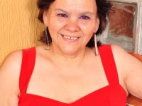 Overweight Latin housewife takes off red dress to pose in lingerie and hose - Photo #1