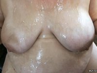 Amateur BBW with huge saggy tits Ashley Bangs enjoys an oral interracial game - Photo #21