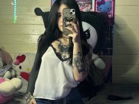 Brunette teen takes selfies while stripping to her thong on a bed - Photo #13