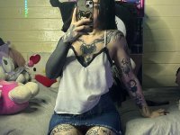 Brunette teen takes selfies while stripping to her thong on a bed - Photo #14