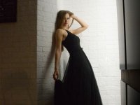 Solo model poses for non-nude shoots in black and orange dresses - Photo #2