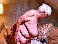 Naughty chubby granny Modesta shows her saggy tits while completely naked - Photo #1