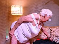 Naughty chubby granny Modesta shows her saggy tits while completely naked - Photo #2