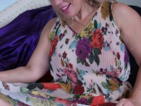 Older blonde woman blows a kiss after stripping to her jewelry - Photo #6