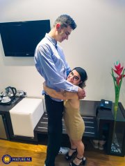 Mature midget with glasses Sara One strips and shows her big tits & ass