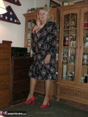 Fat grandmother with blonde hair exposes herself in tan nylons and garters