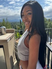 Brunette amateur shows her trimmed pussy before meeting with big names