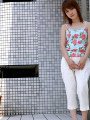 Young Japanese girl Akari shyly puts her hairy muff on display