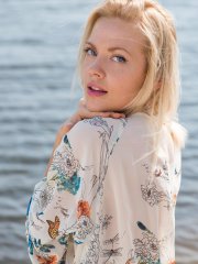 Blonde sweetie Camelia shows her fine body and poses in the sea