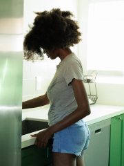 Skinny ebony amateur Angel Avril unveils her nice juggs and amazing bum