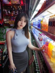 Asian beauty sports a sheer robe in a tempting manner after changing