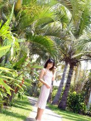 Young looking Japanese girl Saki Ninomiya gets naked with ocean behind her