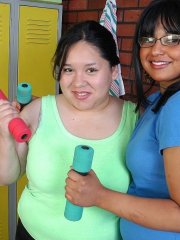 Older dyke Lily and horny gf share double dildo during sex in weight room