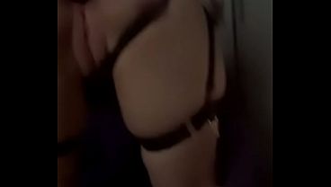 Blonde in Black Lingerie and Boots Teases with Toy from Behind