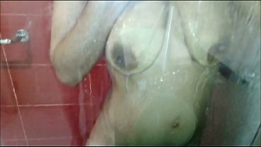 Brunette bathing. Large, saggy, natural breasts.