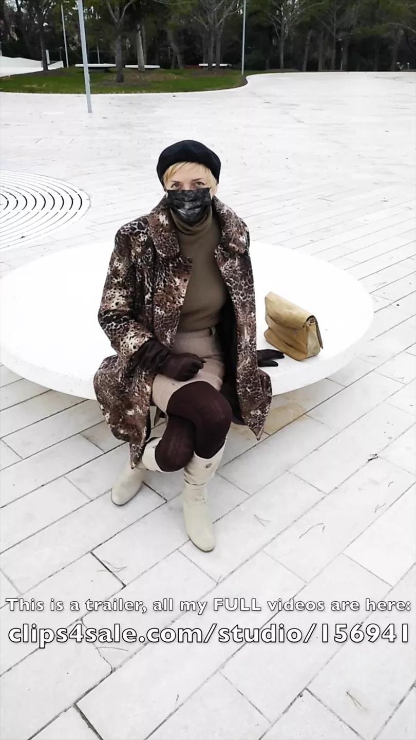Crossed legs orgasm sitting on a bench in a park
