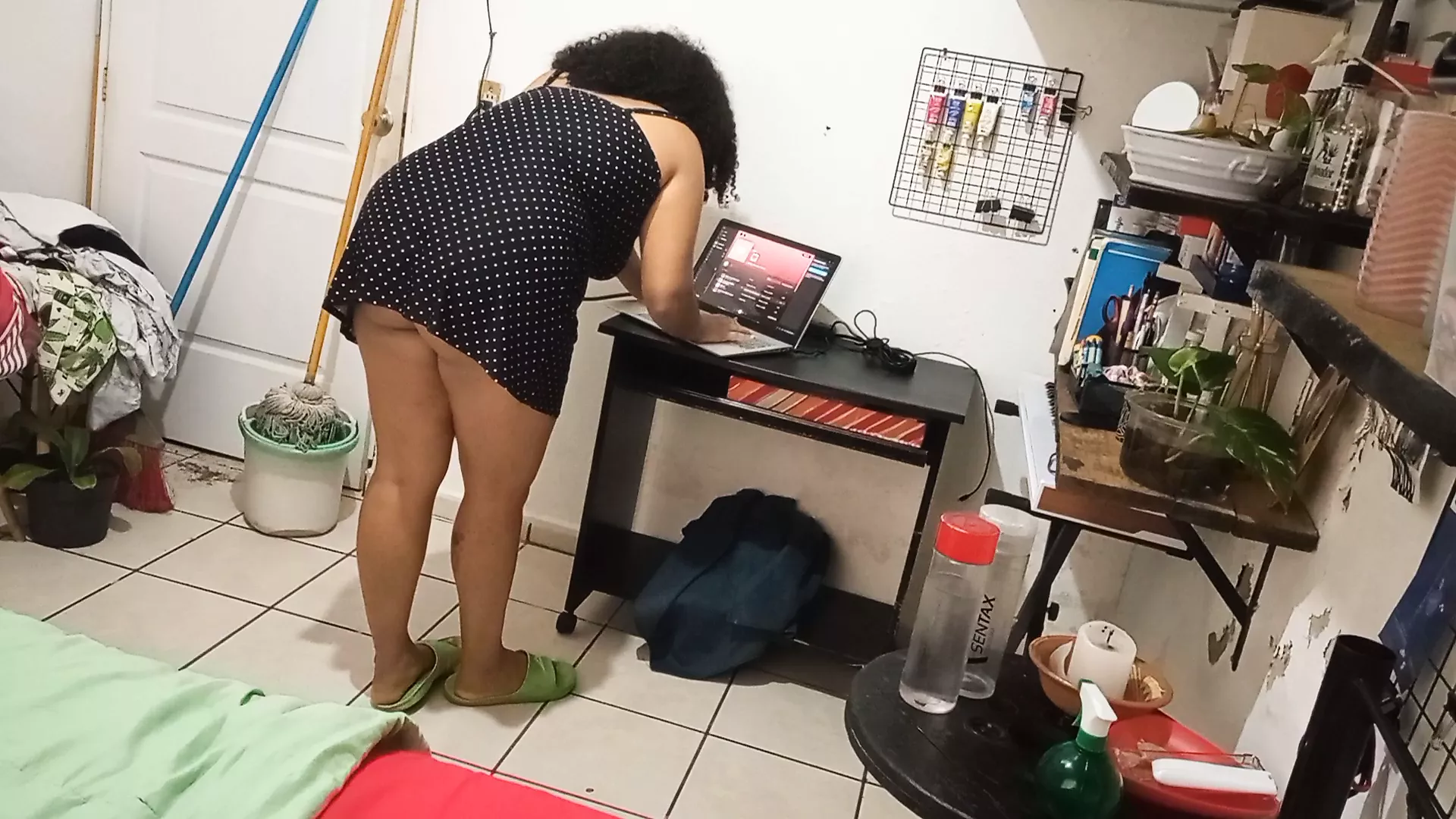 my wife cleaning the room in dress and thong