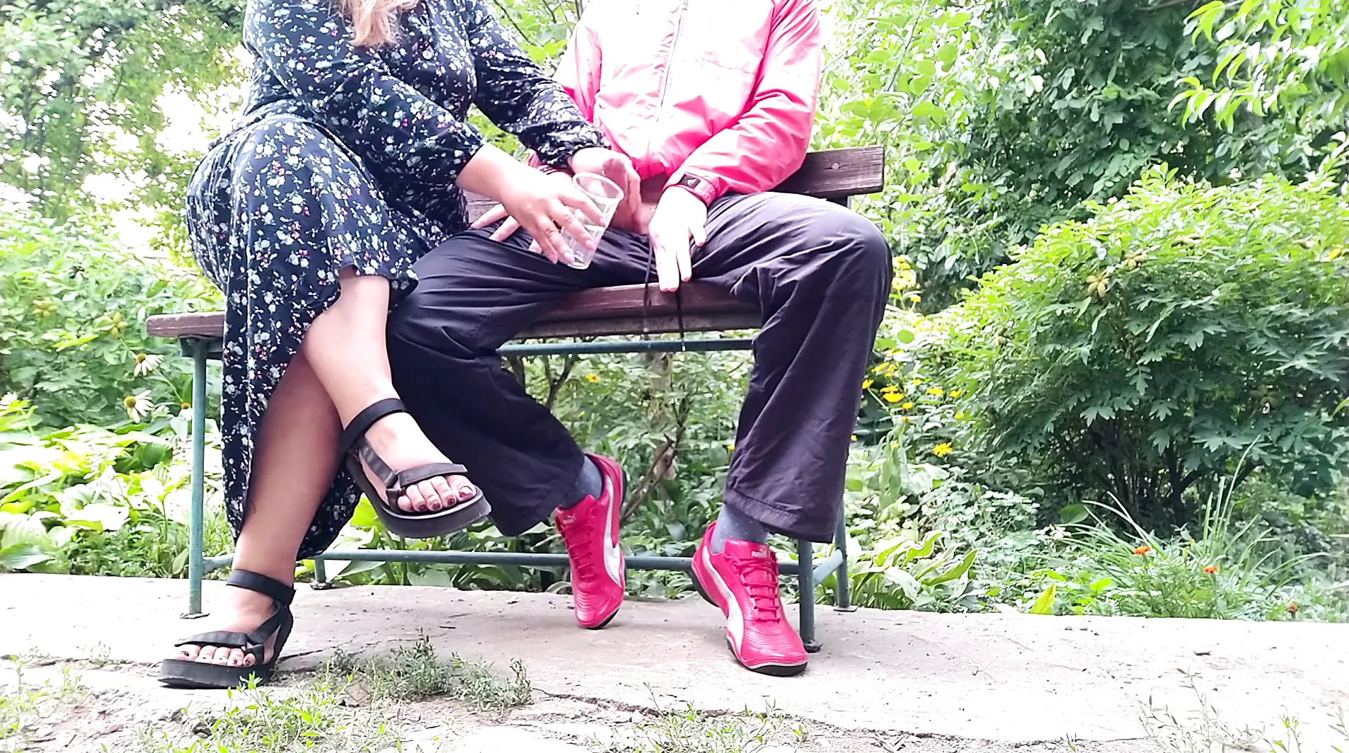 Hot MILF jerks off a big dick into a glass in the park on a bench