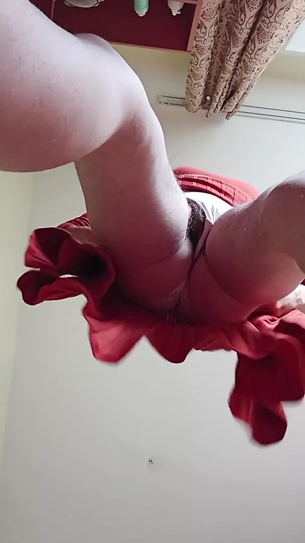 Changing dress. View from the floor. Big butts above you.