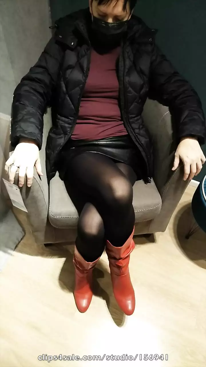 Fully dressed crossed legs orgasm in a store