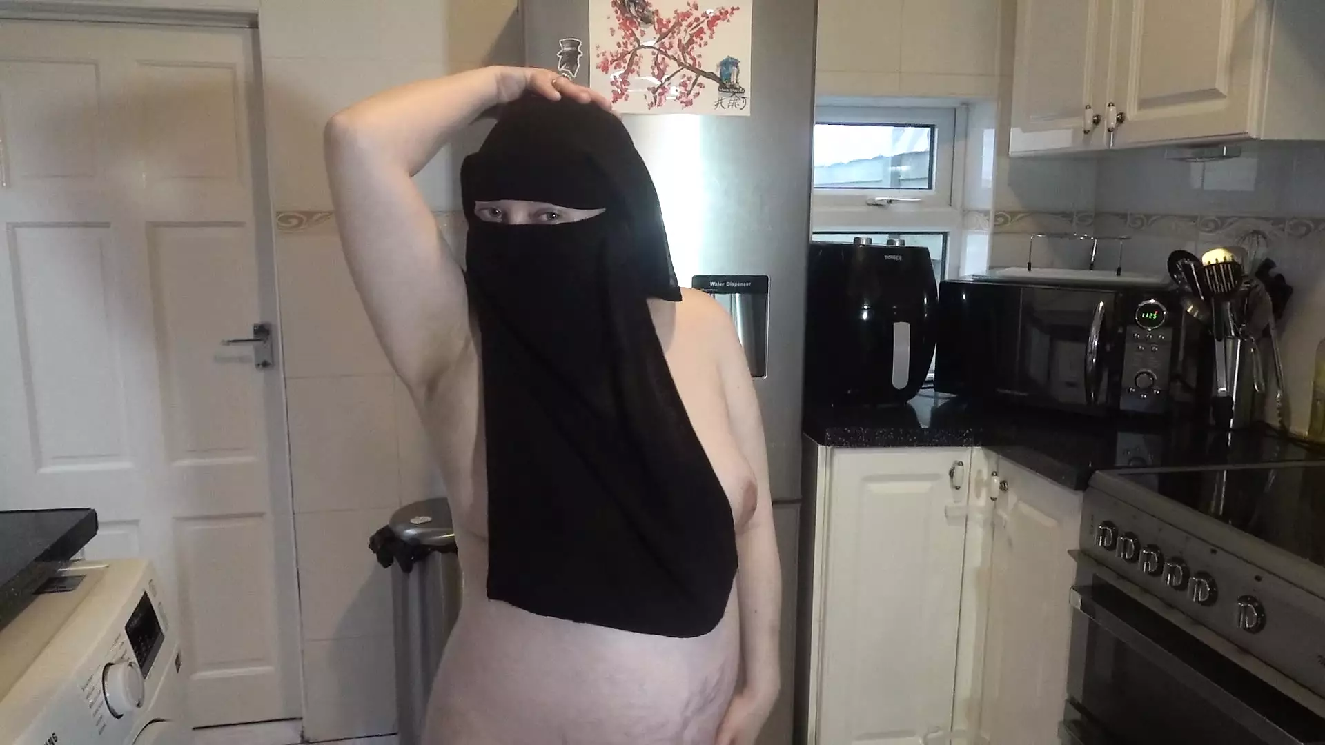 Dancing fully nude in Niqab