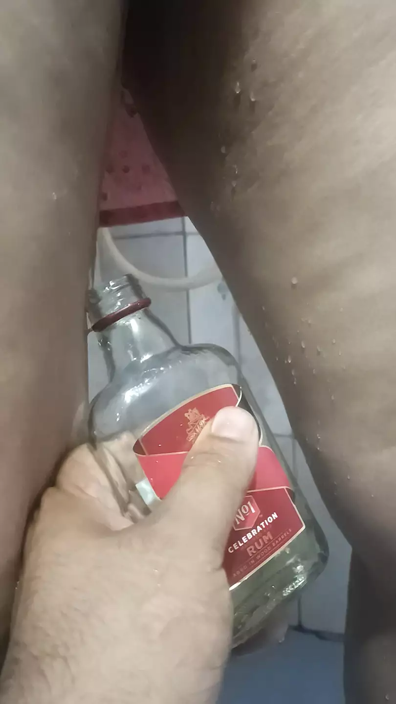 Bhabi pissing in rum bottle
