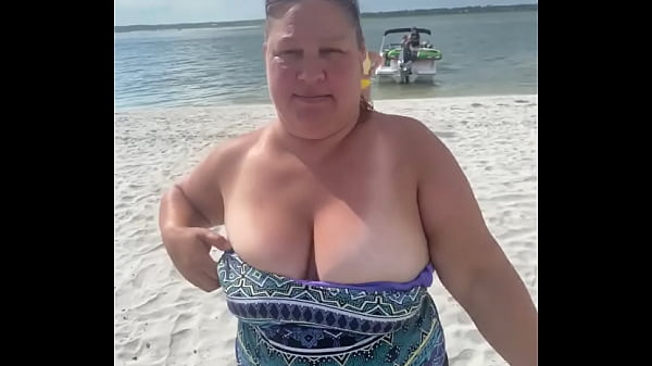 Slutty Bbw duca wife flashes her big tits on a public beach